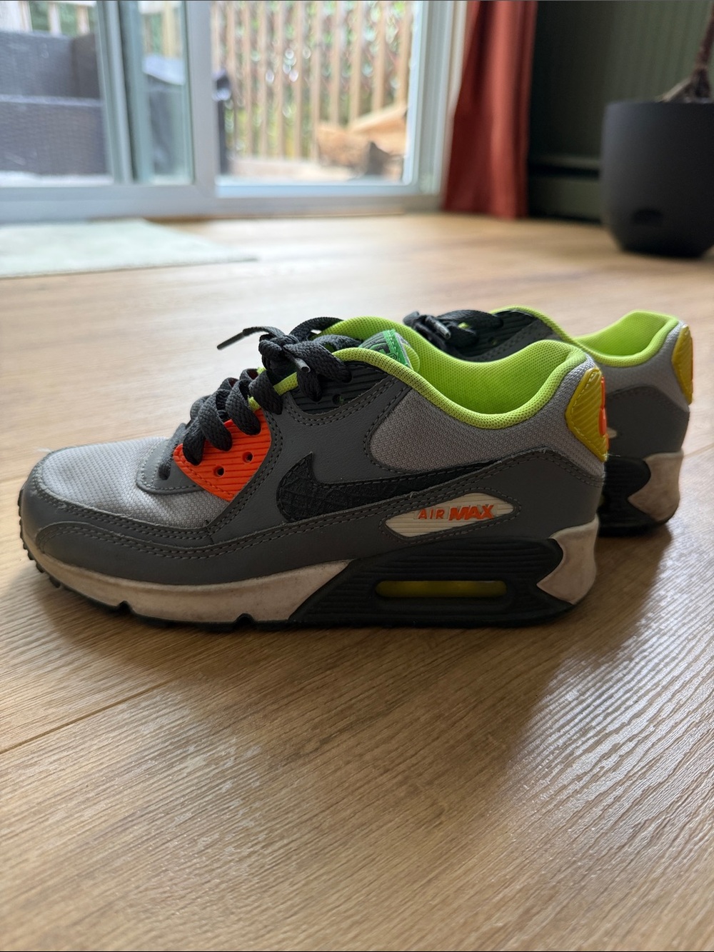 Nike Kids Gray Sneakers with Neon Green and Orange Accents